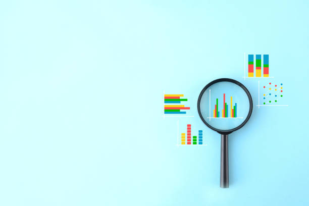 A magnifying glass centered over a bar chart, surrounded by various colorful data icons like line graphs and scatter plots on a light blue background.