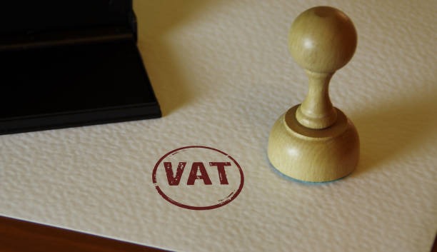 A professional digital illustration showing key icons for VAT registration, TRN verification, and financial tax compliance in the UAE property marke