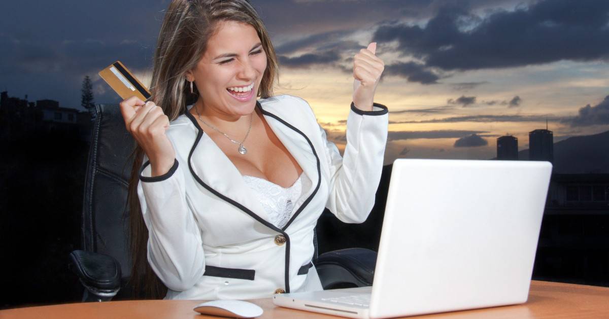 happy in front of the computer