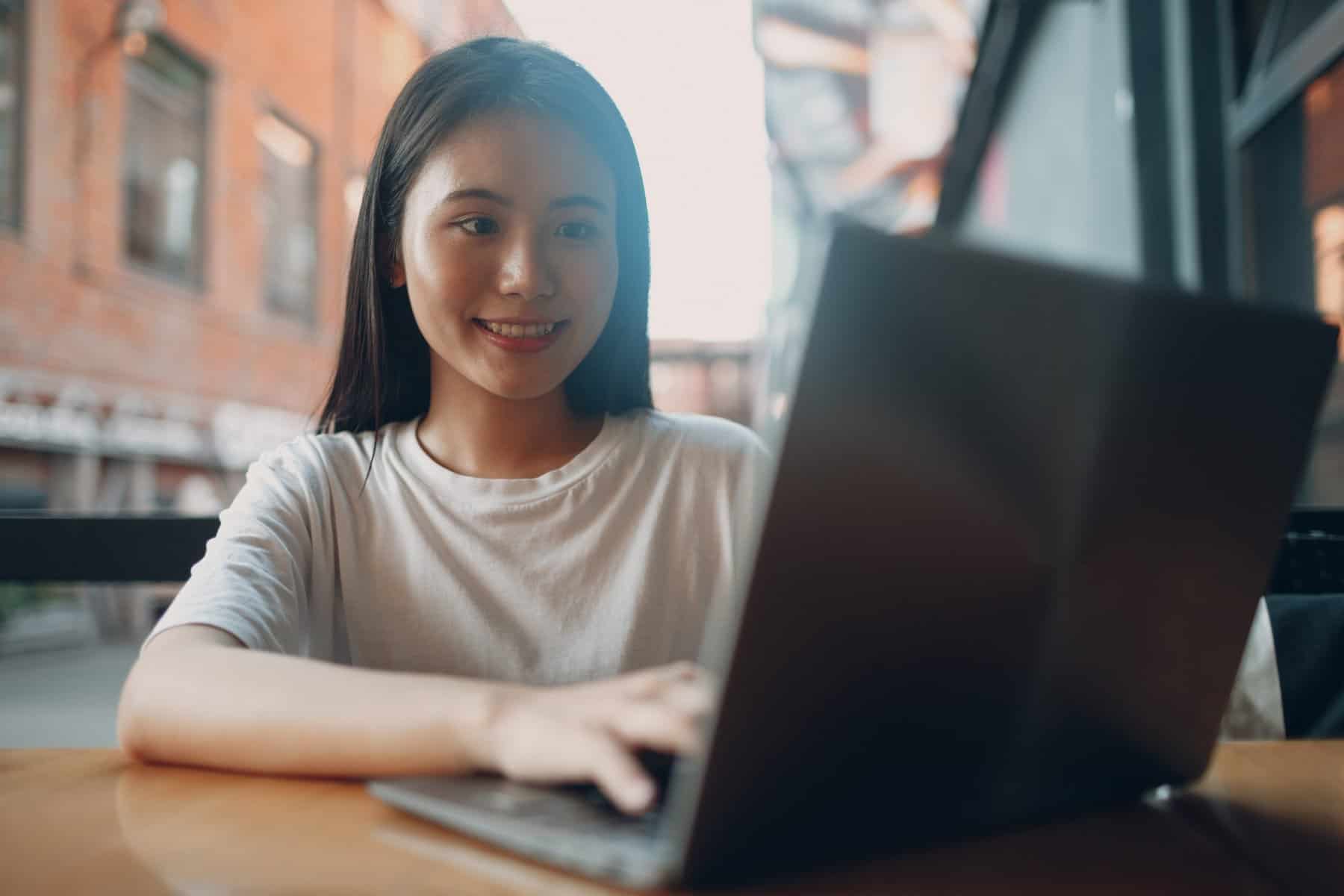 Woman Using Laptop ScopIO scaled 1
