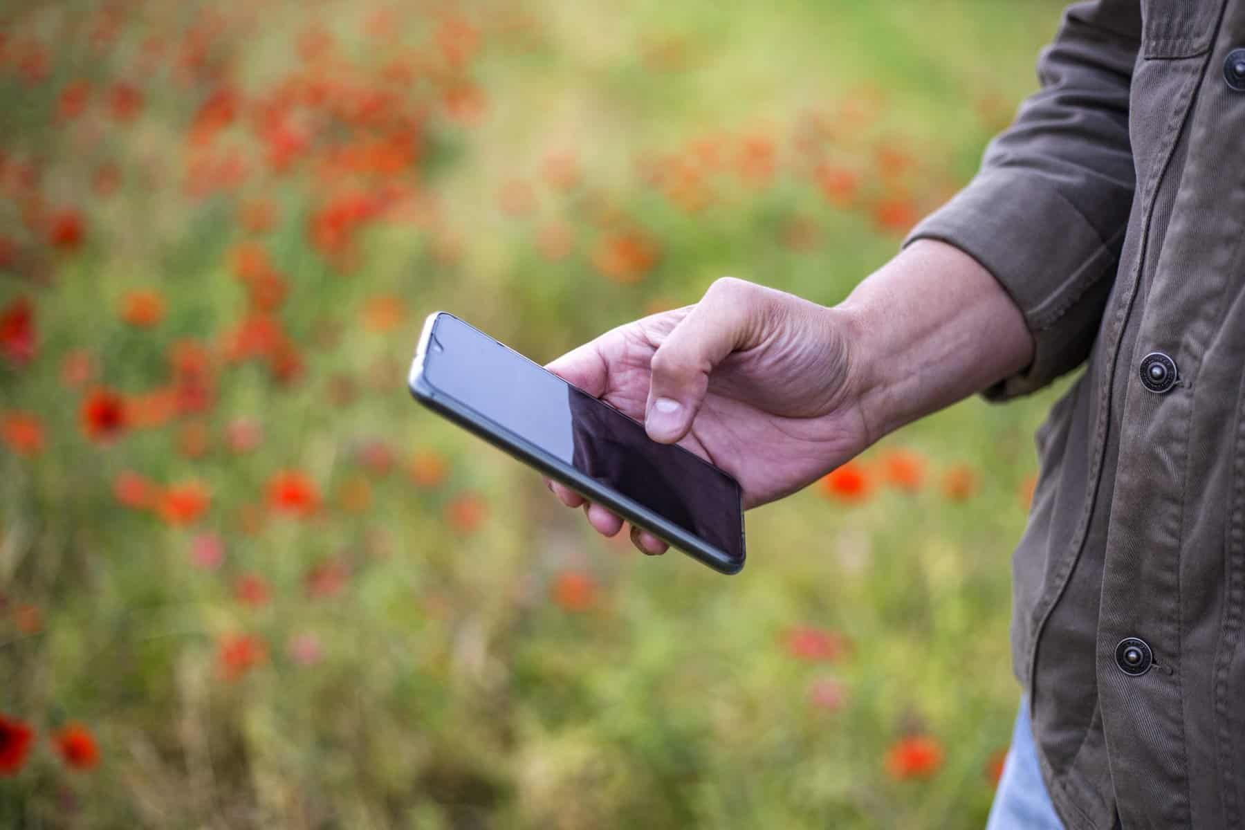 person using smartphone scopIO scaled 7